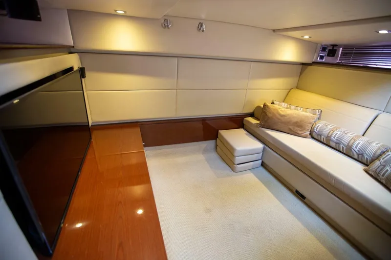  Yacht Photos Pics Luxurious interior of 2015 Sea Ray 450 Sundancer yacht with plush seating and modern design.