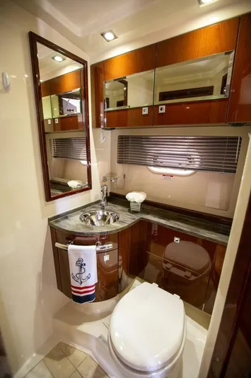  Yacht Photos Pics Luxurious bathroom in 2015 Sea Ray 450 Sundancer yacht with elegant wood finishes.