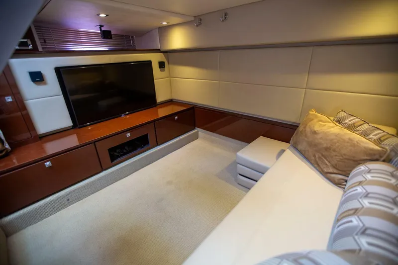  Yacht Photos Pics Luxurious interior of 2015 Sea Ray 450 Sundancer yacht with cozy seating and entertainment system.