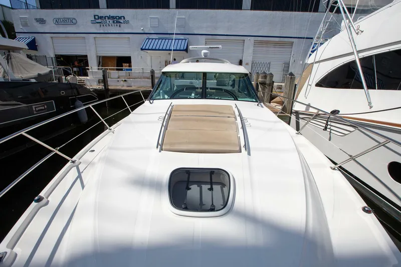  Yacht Photos Pics 2015 Sea Ray 450 Sundancer yacht docked at marina, front deck view.