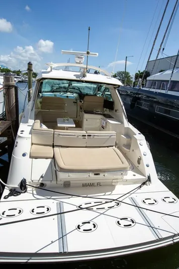  Yacht Photos Pics 2015 Sea Ray 450 Sundancer yacht docked, featuring spacious seating and sleek design.