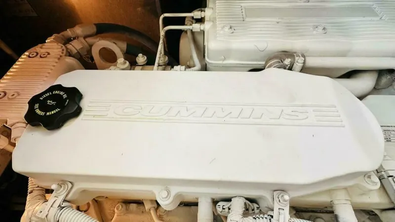  Yacht Photos Pics Cummins engine in 2015 Sea Ray 450 Sundancer boat, showcasing detailed components.