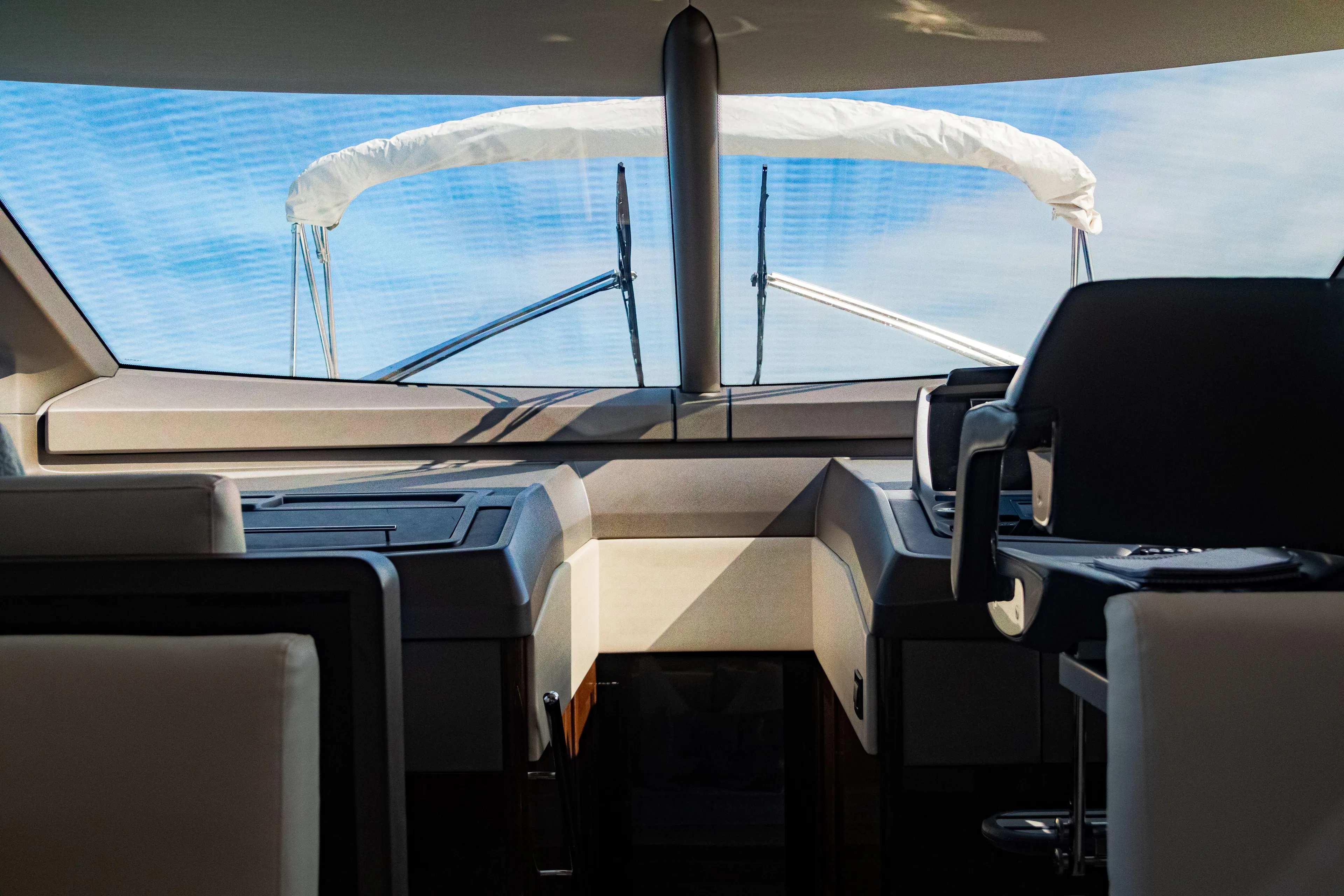 O Legasea Yacht Photos Pics Interior view of 2018 Sunseeker Manhattan 66 yacht cockpit with modern design.