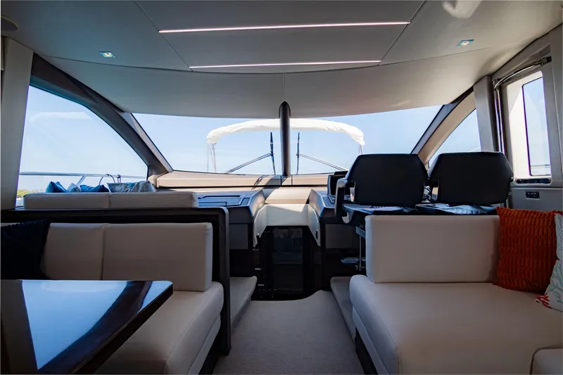 O Legasea Yacht Photos Pics Interior of 2018 Sunseeker Manhattan 66 yacht, featuring luxurious seating and modern design.
