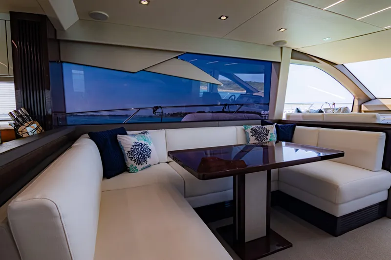 O Legasea Yacht Photos Pics Luxurious interior of 2018 Sunseeker Manhattan 66 yacht with elegant seating area.