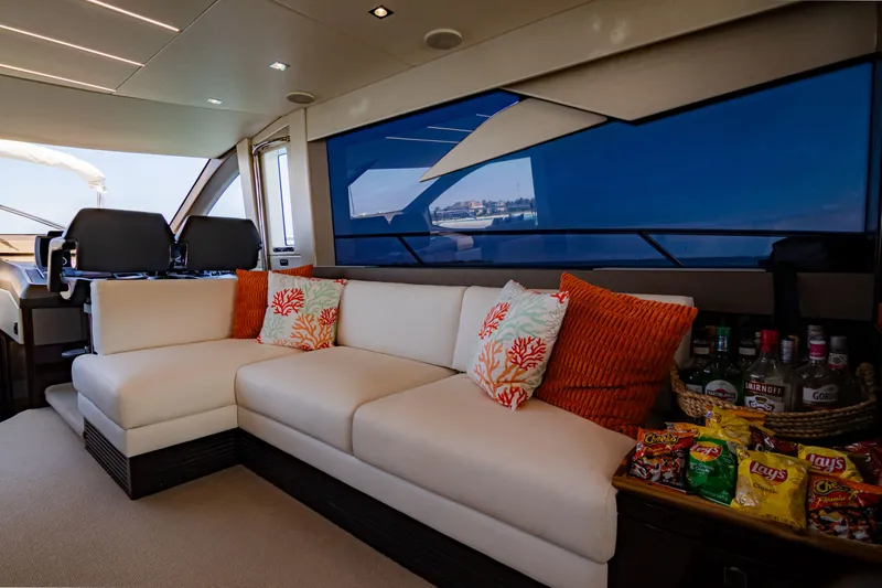 O Legasea Yacht Photos Pics Luxurious interior of 2018 Sunseeker Manhattan 66 yacht with plush seating and snacks.