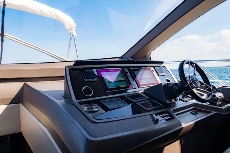 O Legasea Yacht Photos Pics Cockpit of 2018 Sunseeker Manhattan 66 yacht with modern navigation equipment.