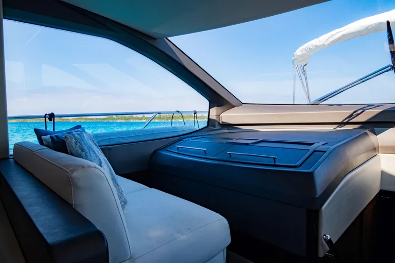 O Legasea Yacht Photos Pics Interior view of 2018 Sunseeker Manhattan 66 yacht with ocean backdrop.
