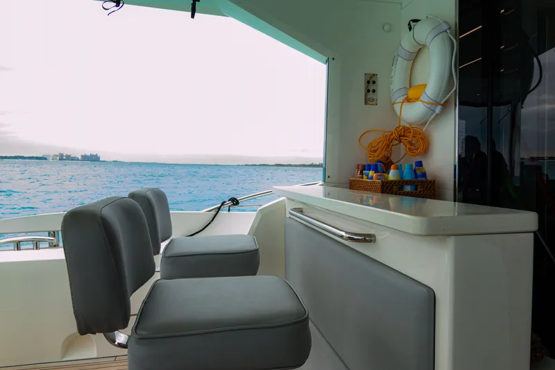 O Legasea Yacht Photos Pics 2018 Sunseeker Manhattan 66 yacht interior with ocean view and seating area.