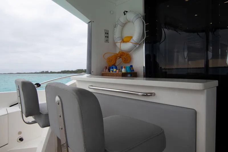 O Legasea Yacht Photos Pics Luxury Sunseeker Manhattan 66 yacht interior, featuring seating and safety equipment, 2018 model.