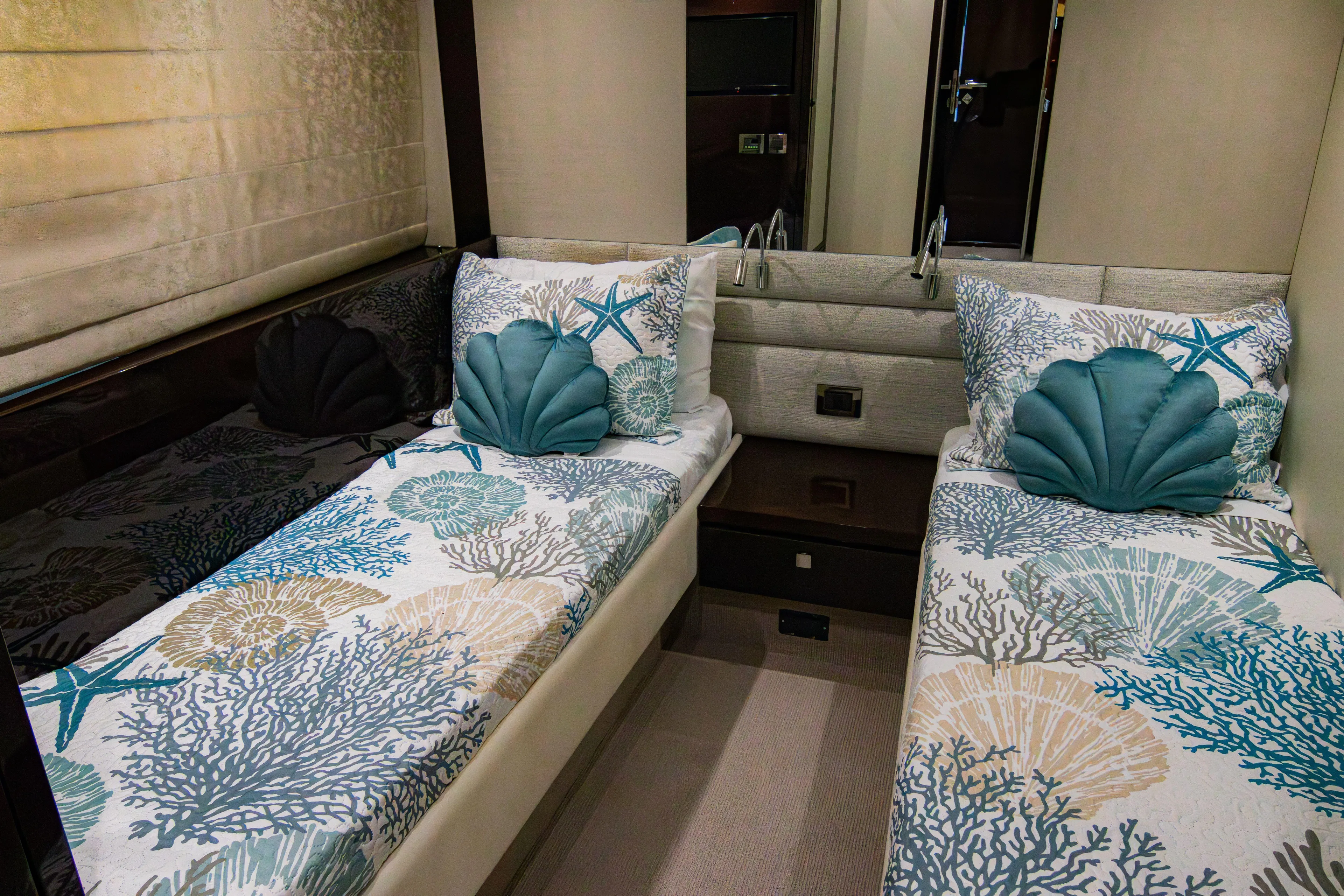 O Legasea Yacht Photos Pics Luxurious twin cabin in 2018 Sunseeker Manhattan 66 yacht with ocean-themed decor.