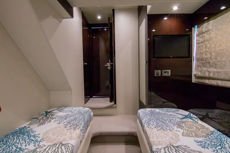 O Legasea Yacht Photos Pics Interior of 2018 Sunseeker Manhattan 66 yacht with twin beds and modern decor.