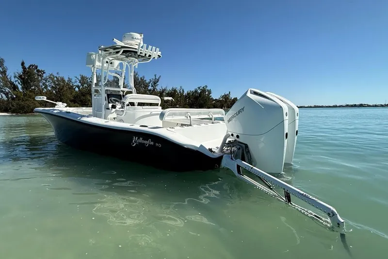  Yacht Photos Pics 2017 Yellowfin 26 Hybrid boat with Mercury engines on calm water.