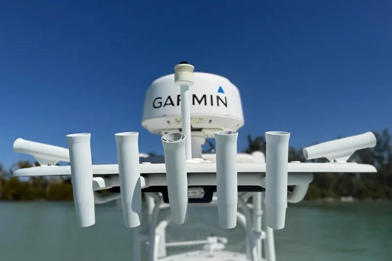  Yacht Photos Pics 2017 Yellowfin 26 Hybrid boat with Garmin radar and rod holders, clear sky background.