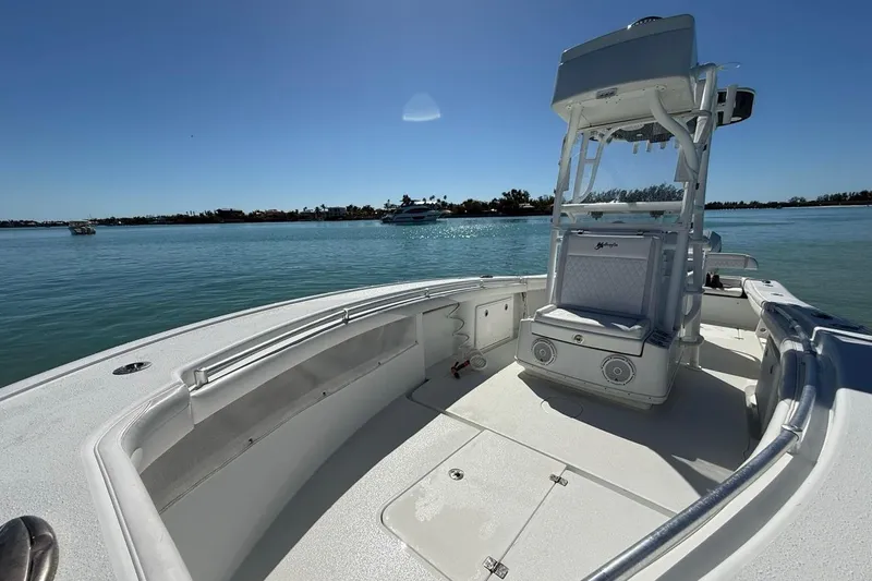  Yacht Photos Pics 2017 Yellowfin 26 Hybrid boat on calm water, clear sky, spacious deck.