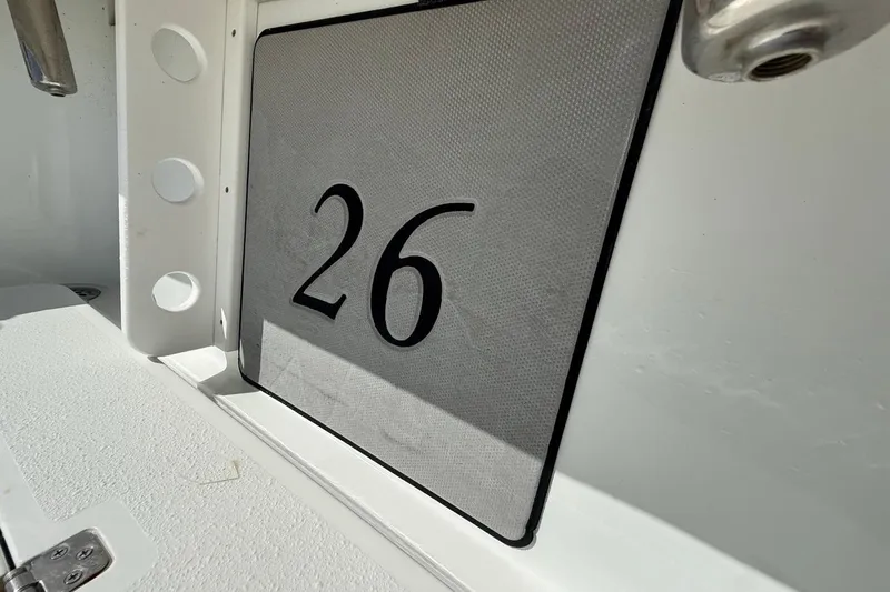  Yacht Photos Pics Close-up of 2017 Yellowfin 26 Hybrid boat interior with number 26 displayed.