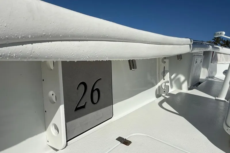  Yacht Photos Pics 2017 Yellowfin 26 Hybrid boat interior with number 26, featuring sleek white design.