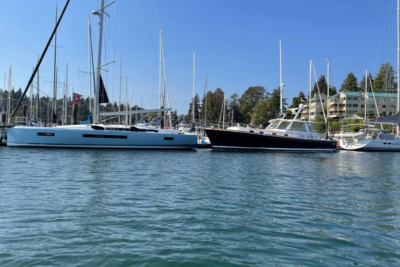 Atticus Yacht Photos Pics Jeanneau Sun Odyssey 490 sailboat docked in a marina, 2022 model.