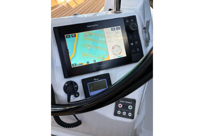 Atticus Yacht Photos Pics Jeanneau Sun Odyssey 490, 2022 model, featuring a Raymarine navigation display at the helm.