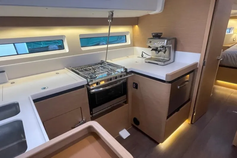 Atticus Yacht Photos Pics Modern kitchen with stove and optional configurable (freezer or frig) drawer.