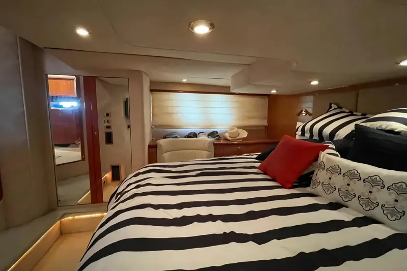 Yacht Photos Pics Luxurious cabin interior of 2004 Sunseeker Predator 56 yacht with striped bedding.