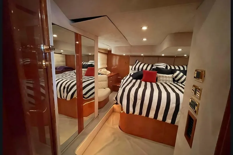  Yacht Photos Pics Luxurious cabin interior of 2004 Sunseeker Predator 56 yacht with striped bedding.