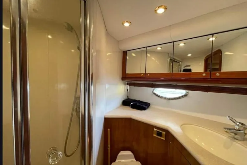  Yacht Photos Pics Luxurious bathroom in 2004 Sunseeker Predator 56 yacht with shower and vanity.
