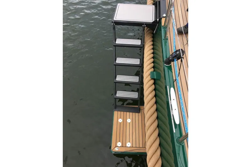 Jaleo Yacht Photos Pics Boat ladder on a 2019 Puffin 50, extending into water.