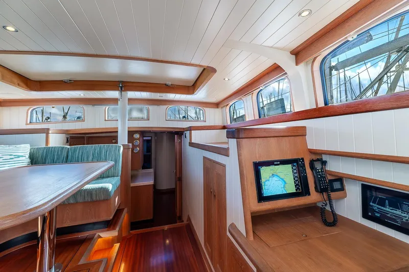 Jaleo Yacht Photos Pics Interior of 2019 Puffin 50 yacht with wood finish and navigation equipment.