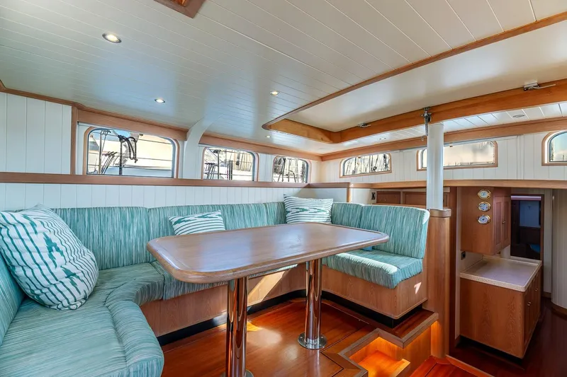 Jaleo Yacht Photos Pics Luxurious interior of 2019 Puffin 50 yacht with elegant seating and wooden finishes.