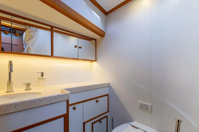 Jaleo Yacht Photos Pics Luxurious yacht bathroom with modern fixtures, wooden accents, and ambient lighting, Puffin 50 model, 2019.