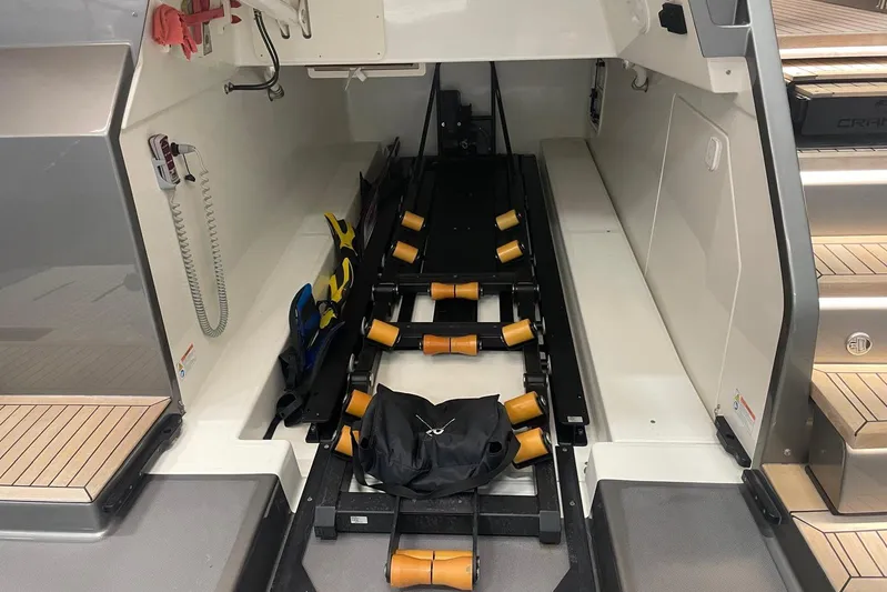  Yacht Photos Pics 2024 Cranchi 67 Sessantasette Fly yacht storage area with equipment and accessories.