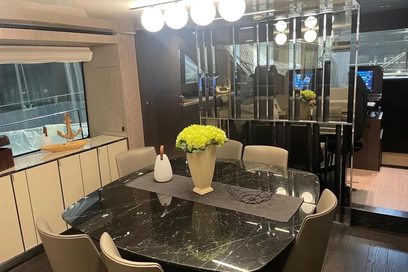  Yacht Photos Pics Luxurious interior of 2024 Cranchi 67 Sessantasette Fly yacht with elegant dining area.