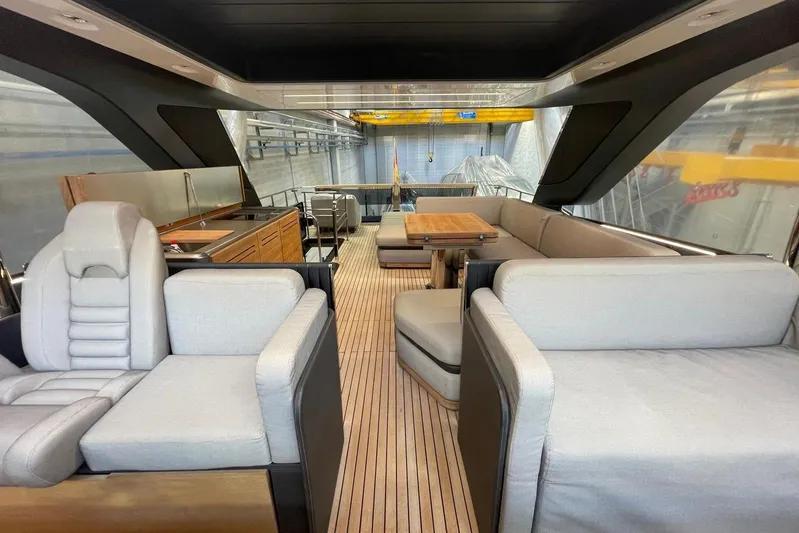  Yacht Photos Pics Luxurious interior of 2024 Cranchi 67 Sessantasette Fly yacht with elegant seating and dining area.