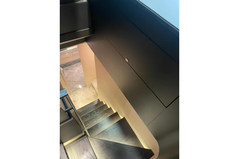  Yacht Photos Pics Staircase inside 2024 Cranchi 67 Sessantasette Fly yacht, featuring sleek modern design.