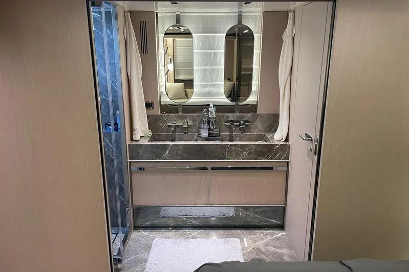  Yacht Photos Pics Luxurious bathroom interior of 2024 Cranchi 67 Sessantasette Fly yacht, featuring elegant marble finishes.