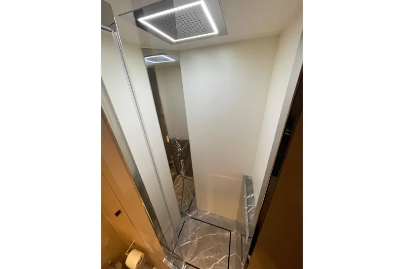  Yacht Photos Pics Luxurious shower area in 2024 Cranchi 67 Sessantasette Fly yacht.