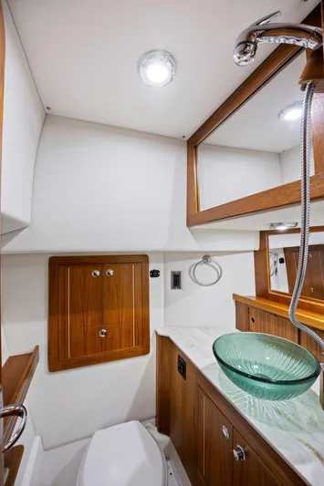 Yacht Photos Pics Modern yacht bathroom with glass sink, wooden cabinetry, and sleek fixtures in Aspen C107, 2026 model.