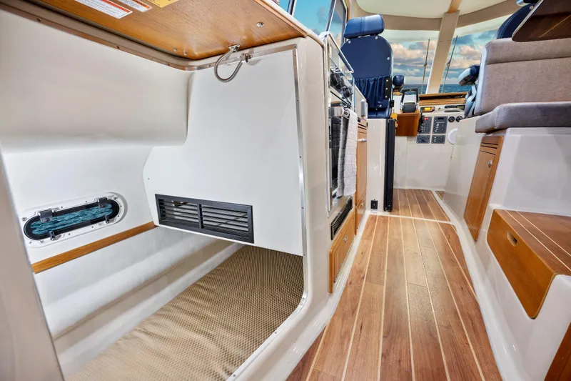  Yacht Photos Pics Interior of 2026 Aspen C107 boat with wood flooring and modern design.