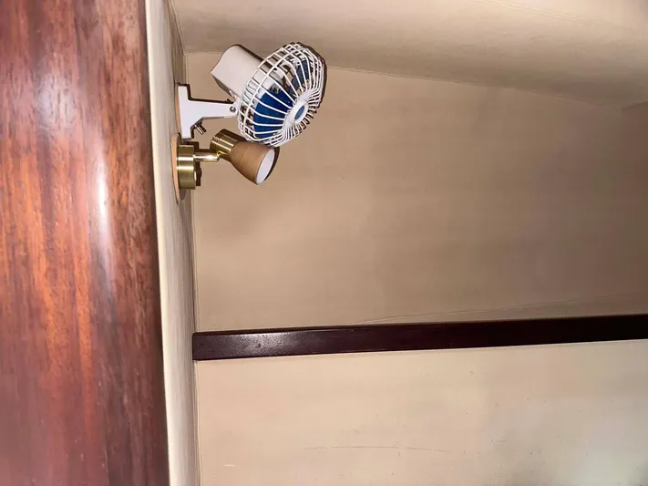 Felice Yacht Photos Pics Interior of 1998 Fountaine Pajot Athena 38 with wall-mounted fan and light fixture.