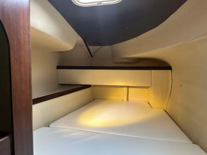 Felice Yacht Photos Pics Interior cabin of 1998 Fountaine Pajot Athena 38 catamaran, featuring cozy sleeping quarters.