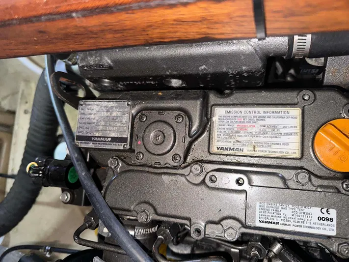 Felice Yacht Photos Pics Engine compartment of a 1998 Fountaine Pajot Athena 38 catamaran, featuring Yanmar emission control labels.