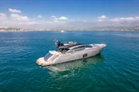 Luxurious 2016 Pershing 82 yacht cruising on serene blue waters under a clear sky.
