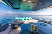 Luxurious 2016 Pershing 82 yacht deck with cushions, sea view, and elegant decor.