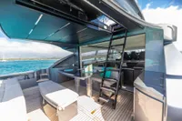 Luxurious 2016 Pershing 82 yacht interior with modern seating and ocean view.
