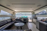 Luxurious interior of 2016 Pershing 82 yacht with panoramic water views and elegant seating.