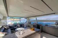Luxurious interior of 2016 Pershing 82 yacht with ocean view and modern furnishings.