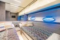 Luxurious interior of 2016 Pershing 82 yacht with twin beds and modern decor.