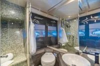 Luxurious bathroom interior on a 2016 Pershing 82 yacht, featuring modern fixtures and elegant design.