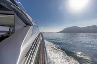 2016 Pershing 82 yacht cruising on calm waters under a bright sun.